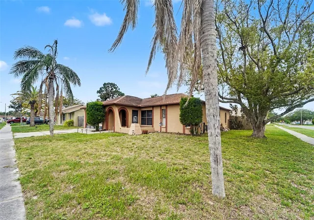 Photo 3 of Single family home for sale at 1215 Persimmon Dr, Holiday, FL 34691 | MLS# TB8514707 | Listing updated on 2026-09-25