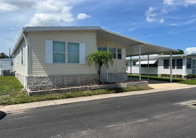 Photo 3 of Manufactured home for sale at 12 Thatch Palm St W, Largo, FL 33770 | MLS# TB8515493 | Listing updated on 2026-10-06