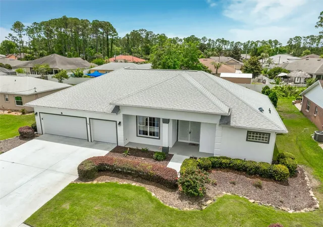 Photo 2 of Single family home for sale at 8 Eastgate Ln, Palm Coast, FL 32164 | MLS# FC319049 | Listing updated on 2026-08-27