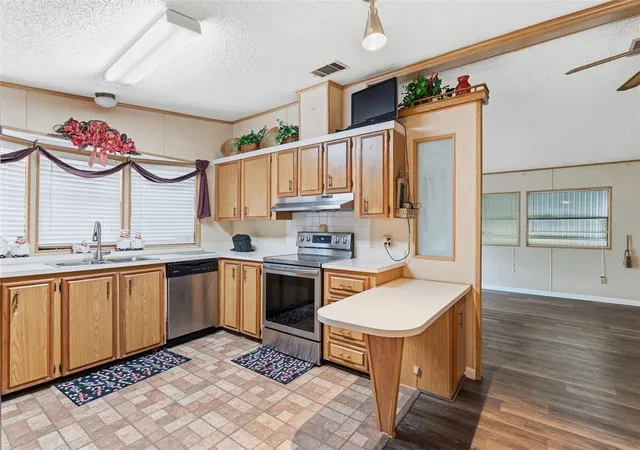 Photo 3 of Manufactured home for sale at 410 Dolphin Dr S, Oldsmar, FL 34677 | MLS# TB8515822 | Listing updated on 2026-08-10