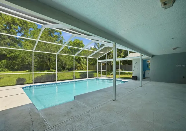 Photo 3 of Single family home for sale at 18451 Winding Oaks Blvd, Hudson, FL 34667 | MLS# W7886480 | Listing updated on 2026-10-03
