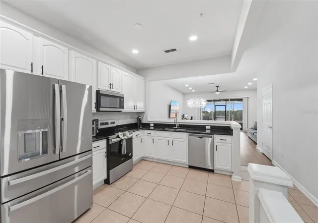 Photo 3 of Townhouse for sale at 6843 Sperone St, Orlando, FL 32819 | MLS# O6414654 | Listing updated on 2026-10-08