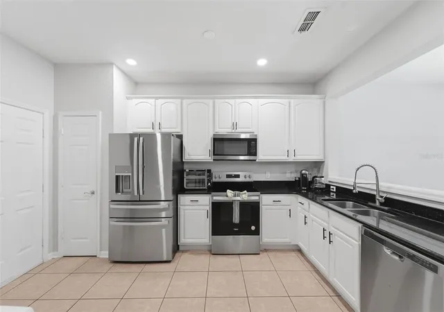 Photo 4 of Townhouse for sale at 6843 Sperone St, Orlando, FL 32819 | MLS# O6414654 | Listing updated on 2026-10-08