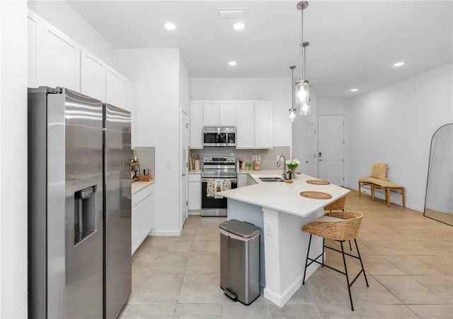 Photo 2 of Townhouse for sale at 10340 Ebb Tide Ln, Orlando, FL 32821 | MLS# O6414665 | Listing updated on 2026-08-16
