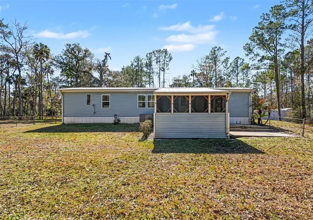 Photo 1 of Manufactured home for sale at 24421 Trespass Trl, Astor, FL 32102 | MLS# V4949524 | Listing updated on 2026-09-01