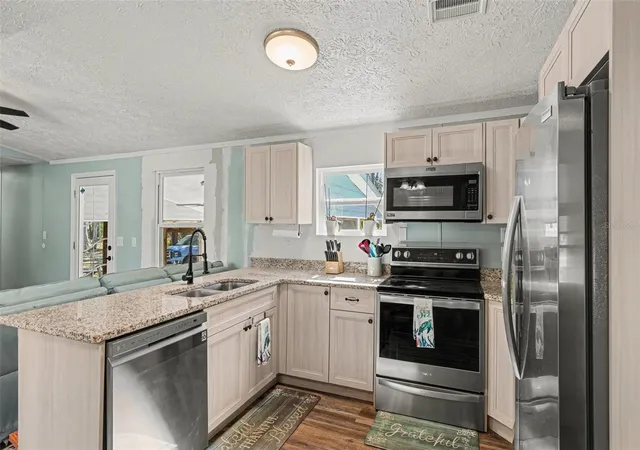 Photo 3 of Manufactured home for sale at 24421 Trespass Trl, Astor, FL 32102 | MLS# V4949524 | Listing updated on 2026-09-01