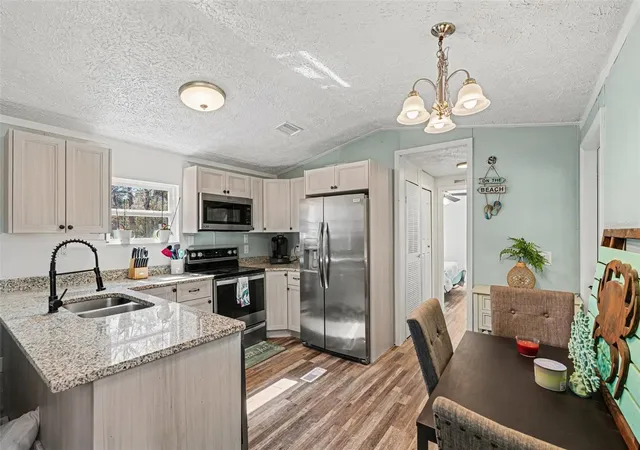 Photo 4 of Manufactured home for sale at 24421 Trespass Trl, Astor, FL 32102 | MLS# V4949524 | Listing updated on 2026-09-01