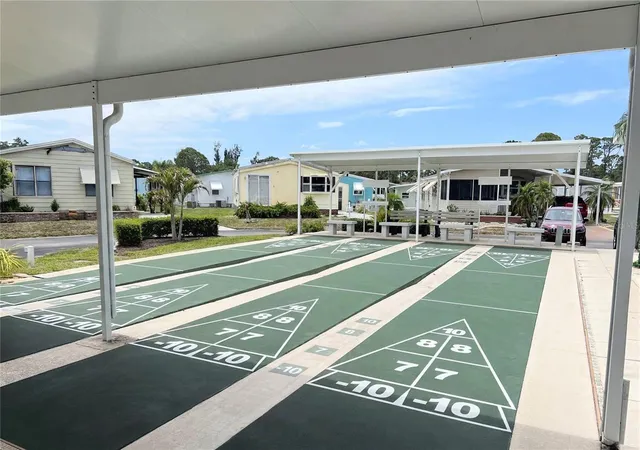 Photo 3 of Manufactured home for sale at 103 S Fiji Cir, Englewood, FL 34223 | MLS# A4696394 | Listing updated on 2026-09-17