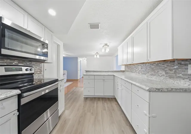 Photo 3 of Single family home for sale at 9316 Mark Twain Ln, Port Richey, FL 34668 | MLS# TB8518178 | Listing updated on 2026-10-02