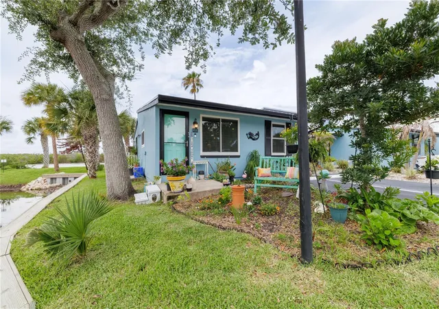 Photo 3 of Condo for sale at 100 Poinciana Cvs Ct #100, New Smyrna Beach, FL 32169 | MLS# O6416012 | Listing updated on 2026-08-04