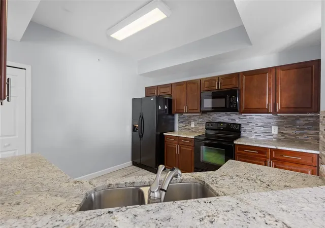 Photo 3 of Condo for sale at 6336 Buford St #801, Orlando, FL 32835 | MLS# O6416544 | Listing updated on 2026-08-06
