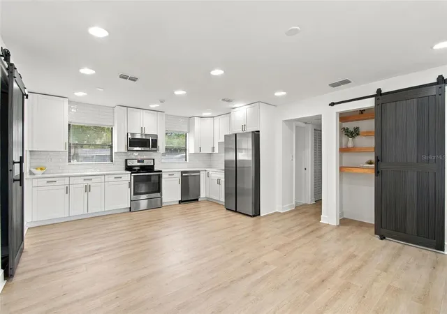 Photo 2 of Single family home for sale at 1702 W Johnston Ave, Tampa, FL 33603 | MLS# TB8519029 | Listing updated on 2026-09-22