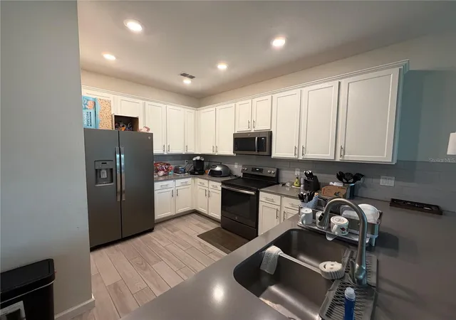 Photo 1 of Townhouse for sale at 9896 Red Eagle Dr, Orlando, FL 32825 | MLS# O6416778 | Listing updated on 2026-08-18