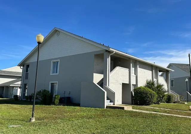 Photo 1 of Condo for sale at 5613 Blue Shadows Ct #60-2, Orlando, FL 32811 | MLS# O6416784 | Listing updated on 2026-09-03