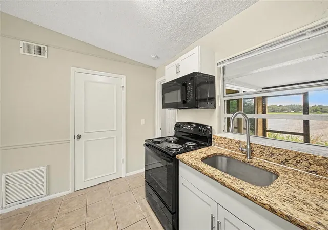 Photo 3 of Townhouse for sale at 1188 Woodman Way, Orlando, FL 32818 | MLS# O6416917 | Listing updated on 2026-09-25