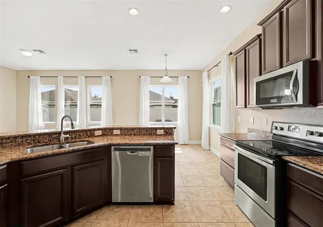 Photo 4 of Single family home for sale at 7614 Atwood Dr, Wesley Chapel, FL 33545 | MLS# TB8519798 | Listing updated on 2026-08-21