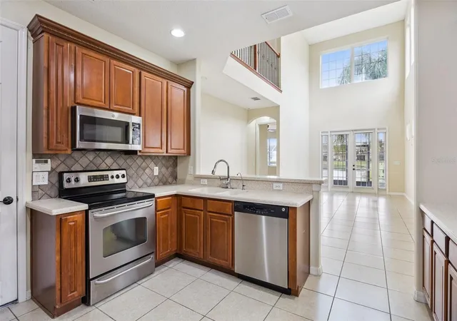 Photo 3 of Townhouse for sale at 551 Ter Spring Dr, Orlando, FL 32828 | MLS# O6418210 | Listing updated on 2026-09-06