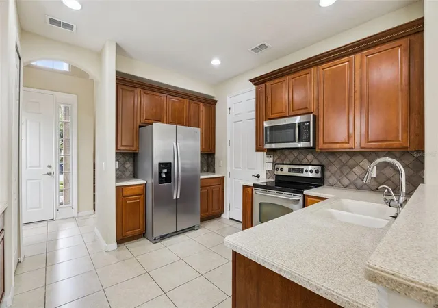 Photo 4 of Townhouse for sale at 551 Ter Spring Dr, Orlando, FL 32828 | MLS# O6418210 | Listing updated on 2026-09-06