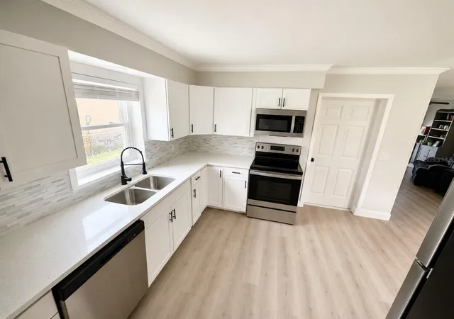 Photo 3 of Single family home for sale at 300 S Buena Vista Ave, Orlando, FL 32835 | MLS# TB8521063 | Listing updated on 2026-09-03