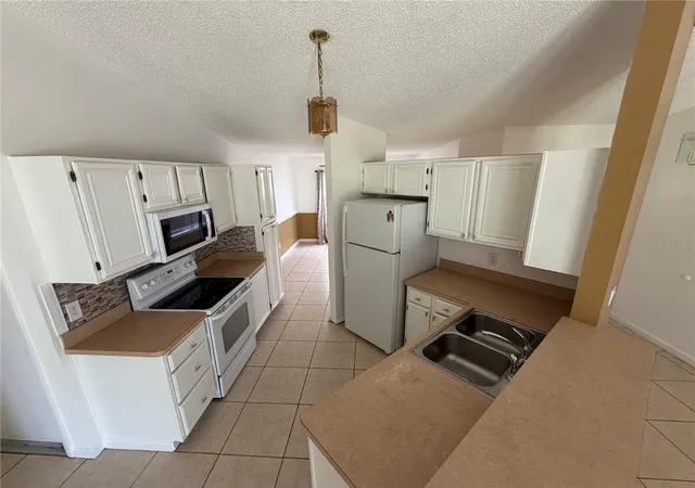 Photo 3 of Single family home for sale at 8061 Windy Hl Way, Orlando, FL 32818 | MLS# O6418300 | Listing updated on 2026-08-21