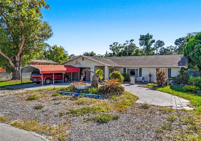 Photo 2 of Single family home for sale at 7813 Leo Kidd Ave, Port Richey, FL 34668 | MLS# W7886977 | Listing updated on 2026-08-17