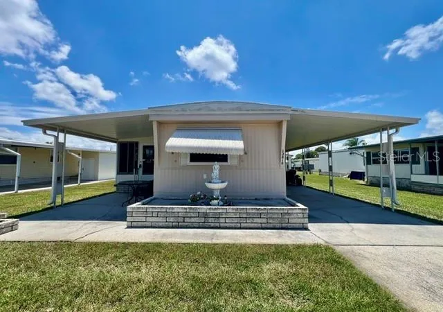 Photo 1 of Manufactured home for sale at 10818 Freedom Dr, Port Richey, FL 34668 | MLS# W7887014 | Listing updated on 2026-06-24