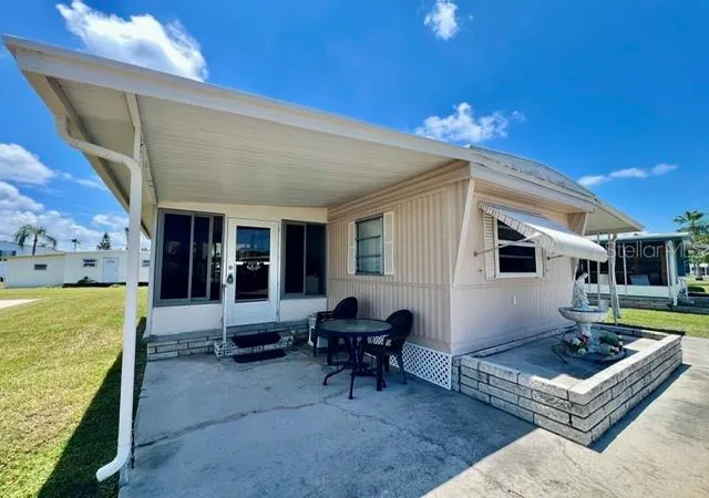 Photo 2 of Manufactured home for sale at 10818 Freedom Dr, Port Richey, FL 34668 | MLS# W7887014 | Listing updated on 2026-06-24
