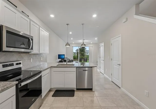 Photo 4 of Townhouse for sale at 31337 Amberview Bnd, Wesley Chapel, FL 33545 | MLS# TB8522993 | Listing updated on 2026-08-26
