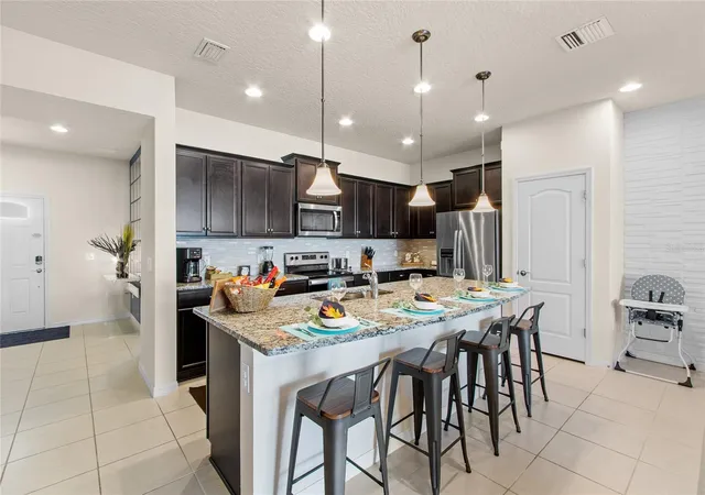Photo 3 of Townhouse for sale at 2426 Tangier Dr, Kissimmee, FL 34747 | MLS# O6419842 | Listing updated on 2026-06-25