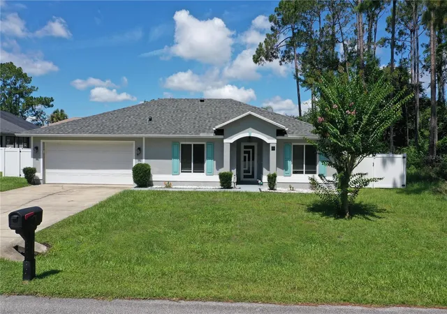 1st image of 21 Lake Charles Ln, Palm Coast, FL 32137 | MLS# FC319521