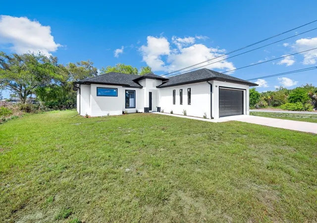 1st image of 100 Parish Dr, Lehigh Acres, FL 33974 | MLS# TB8524942