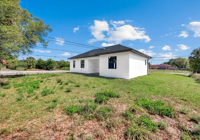 30th image of 100 Parish Dr, Lehigh Acres, FL 33974 | MLS# TB8524942