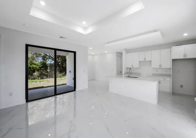 4th image of 100 Parish Dr, Lehigh Acres, FL 33974 | MLS# TB8524942