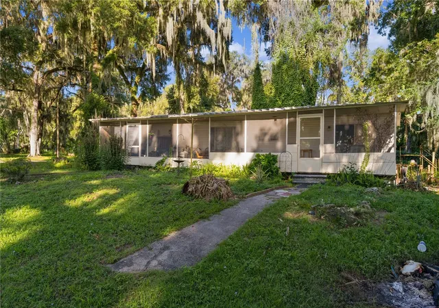 1st image of 1975 E Cr412 Rd, Lake Panasoffkee, FL 33538 | MLS# O6422038