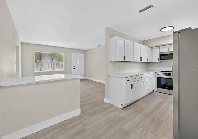 Photo 4 of Single family home for sale at 413 Country Clb Dr, Oldsmar, FL 34677 | MLS# O6422167 | Listing updated on 2026-07-04