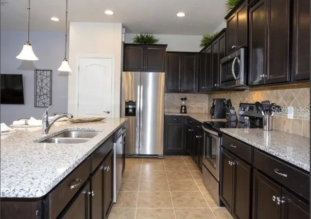 Photo 1 of Townhouse for sale at 8875 Geneve Ct, Kissimmee, FL 34747 | MLS# O6422639 | Listing updated on 2026-07-07