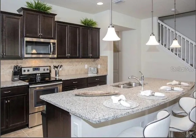 Photo 2 of Townhouse for sale at 8875 Geneve Ct, Kissimmee, FL 34747 | MLS# O6422639 | Listing updated on 2026-07-07