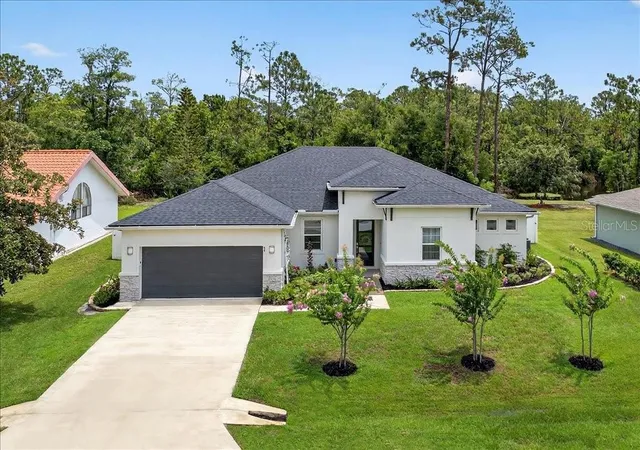 Photo 1 of Single family home for sale at 44 Boulder Rock Dr, Palm Coast, FL 32137 | MLS# FC319762 | Listing updated on 2026-07-11