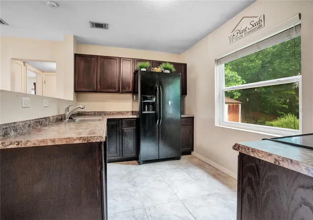 Photo 3 of Single family home for sale at 4901 Bristol Ct, Orlando, FL 32808 | MLS# O6422806 | Listing updated on 2026-10-07