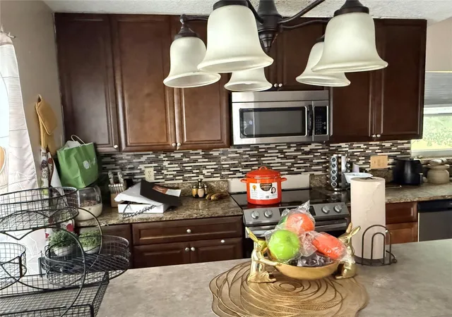 Photo 4 of Single family home for sale at 2665 Staley Ct, Orlando, FL 32818 | MLS# O6423301 | Listing updated on 2026-07-18