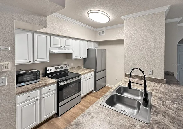 Photo 4 of Condo for sale at 911 N Orange Ave #232, Orlando, FL 32801 | MLS# O6423498 | Listing updated on 2026-09-25