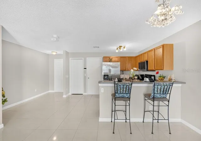 Photo 4 of Townhouse for sale at 12640 Somerset Oaks St, Orlando, FL 32828 | MLS# O6423528 | Listing updated on 2026-07-20