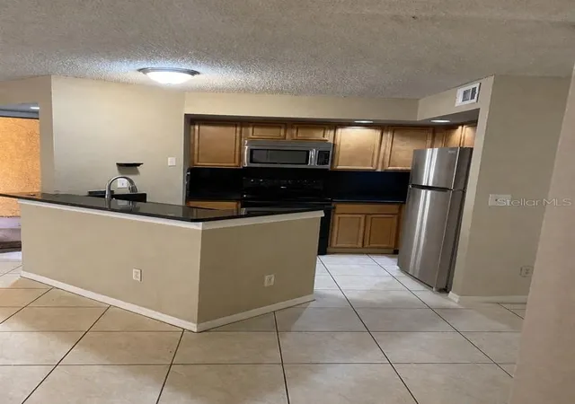 Photo 2 of Condo for sale at 4524 Commander Dr #1615, Orlando, FL 32822 | MLS# O6423833 | Listing updated on 2026-07-10