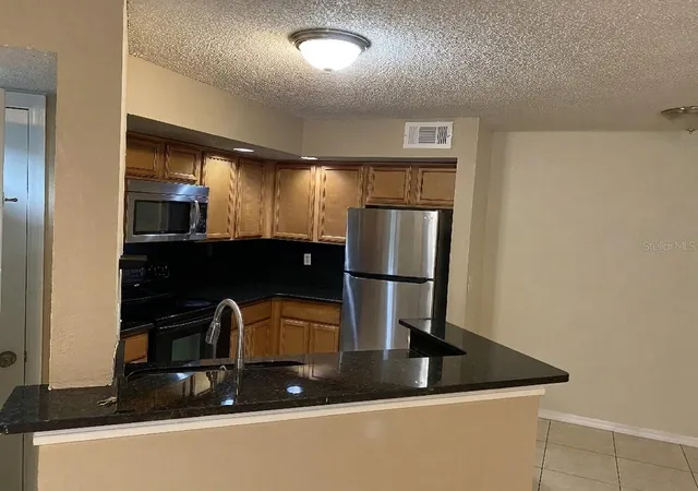 Listing Photo 5 - Condo for sale in building located at 4524 Commander Dr, Orlando, FL 32822 - Unit #1615