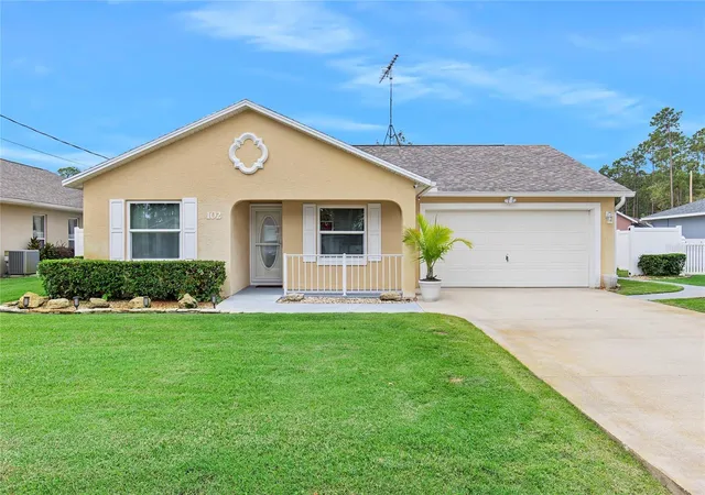 Photo 1 of Single family home for sale at 102 Eastwood Dr, Palm Coast, FL 32164 | MLS# FC319856 | Listing updated on 2026-07-10