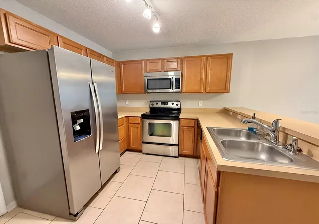 Photo 3 of Townhouse for sale at 609 Cresting Oak Cir #98, Orlando, FL 32824 | MLS# S5153423 | Listing updated on 2026-08-10