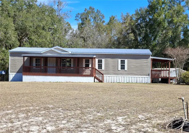 Photo 1 of Manufactured home for sale at 3289 Ne County Rd 340, High Springs, FL 32643 | MLS# GC541866 | Listing updated on 2026-08-28