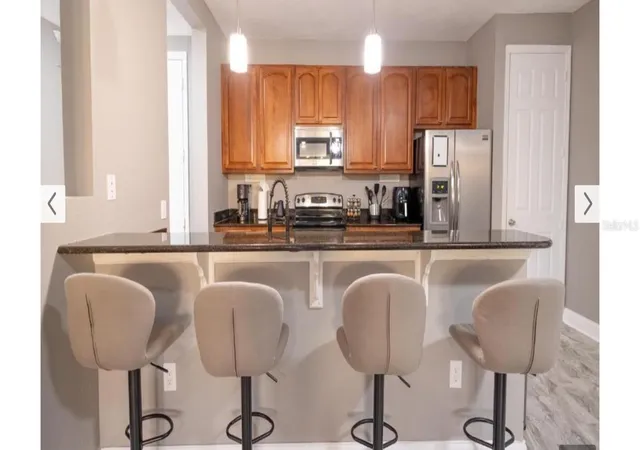 Listing Photo 1 - Condo for sale in building located at 5024 Shoreway Loop, Orlando, FL 32819 - Unit #20106