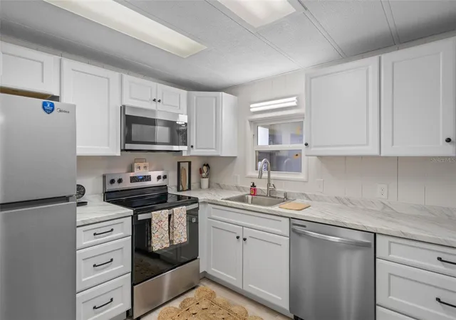 Photo 2 of Manufactured home for sale at 3450 Osage Dr, Zephyrhills, FL 33541 | MLS# W7887546 | Listing updated on 2026-10-07