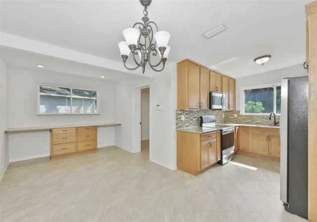 Photo 3 of Single family home for sale at 704 E River Dr, Temple Terrace, FL 33617 | MLS# TB8528284 | Listing updated on 2026-09-12
